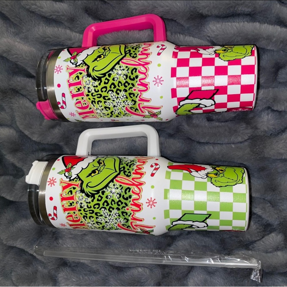 1 pink and 1 green grinch tumbler.